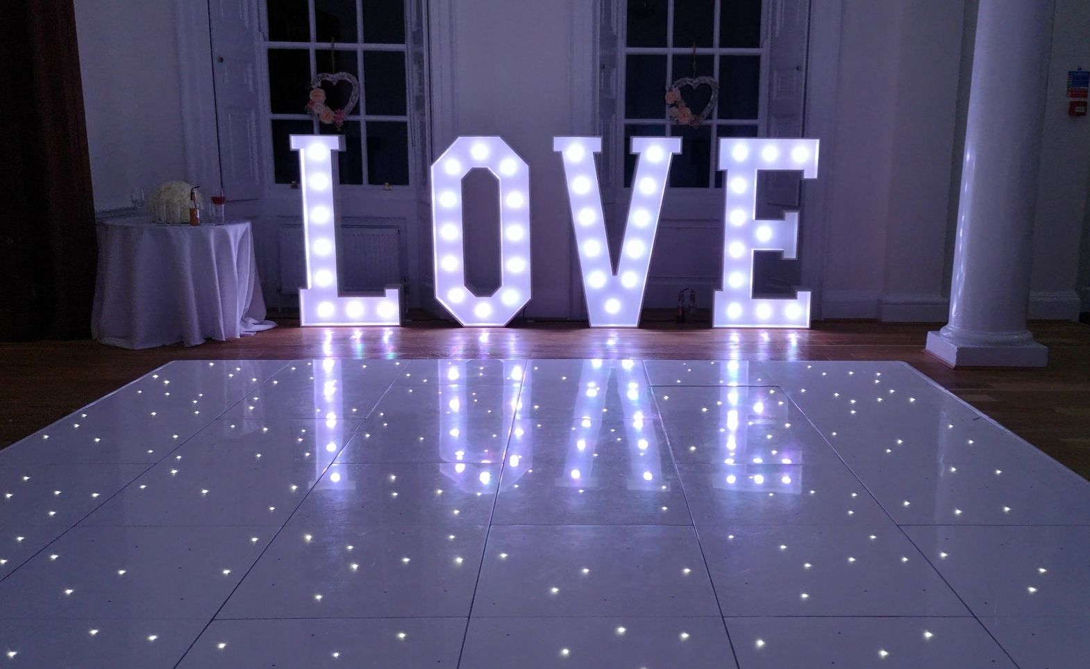Image of Large White LED Letters spelling LOVE paired with a white LED Dance Floor